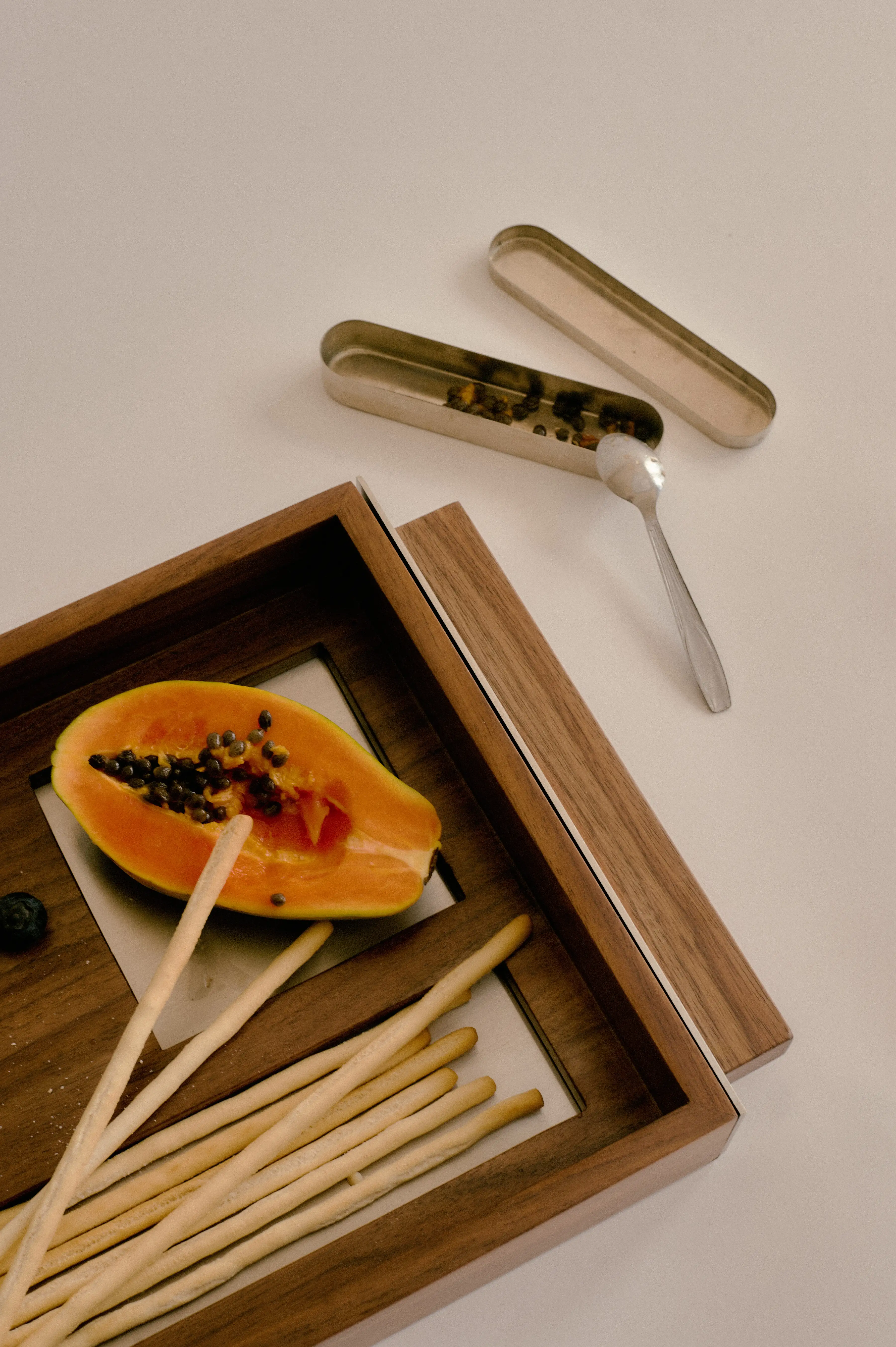 Ground olive pit granules in varying particle sizes, bound to form durable and recyclable composite for This is Not Cork